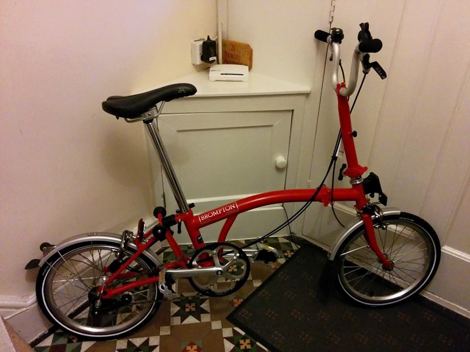 Red Brompton folding bike